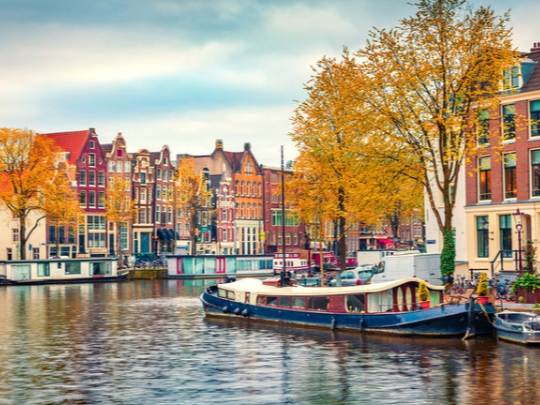 Nighttime panorama of Basel Christmas market with illuminated cathedral – end point of Amsterdam to Basel river cruise